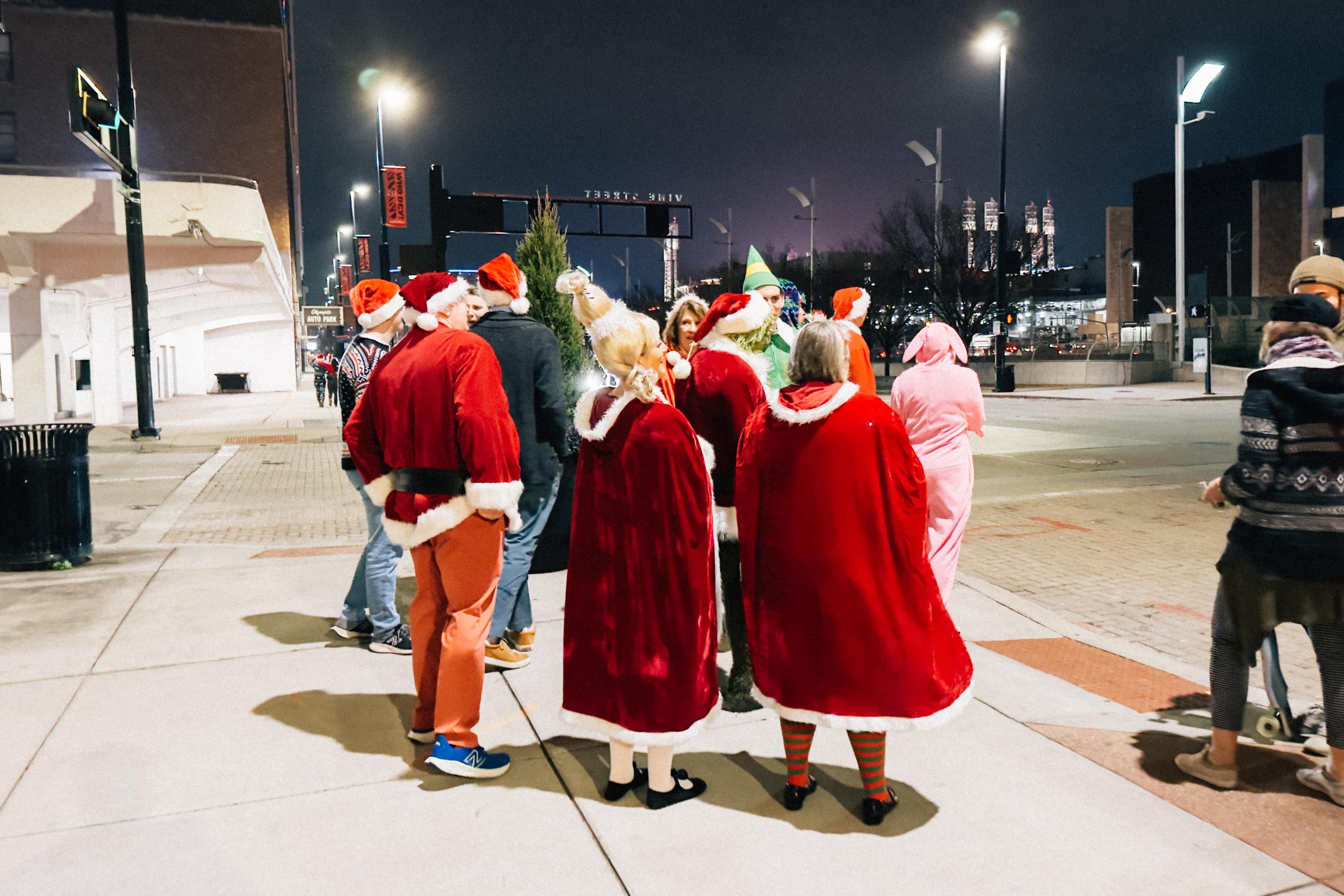 People dressed in Santa inspired outfits