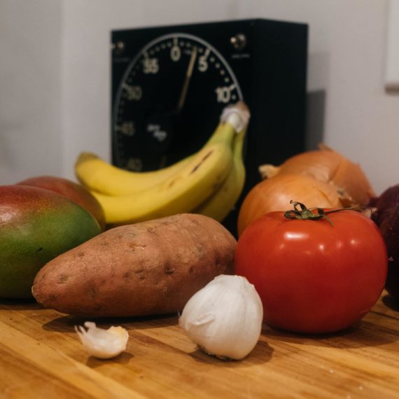 Fruit and vegetables on a wood cutting board