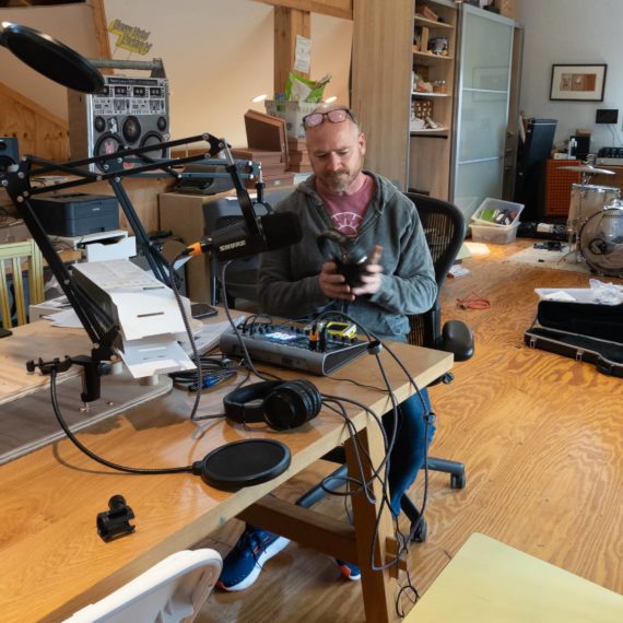 A man gets ready to put on headphones