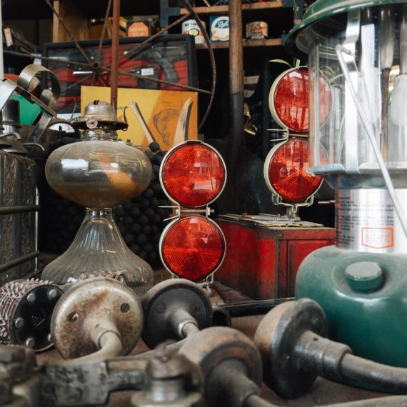 Lamps and reflectors in a window display of a hardware store