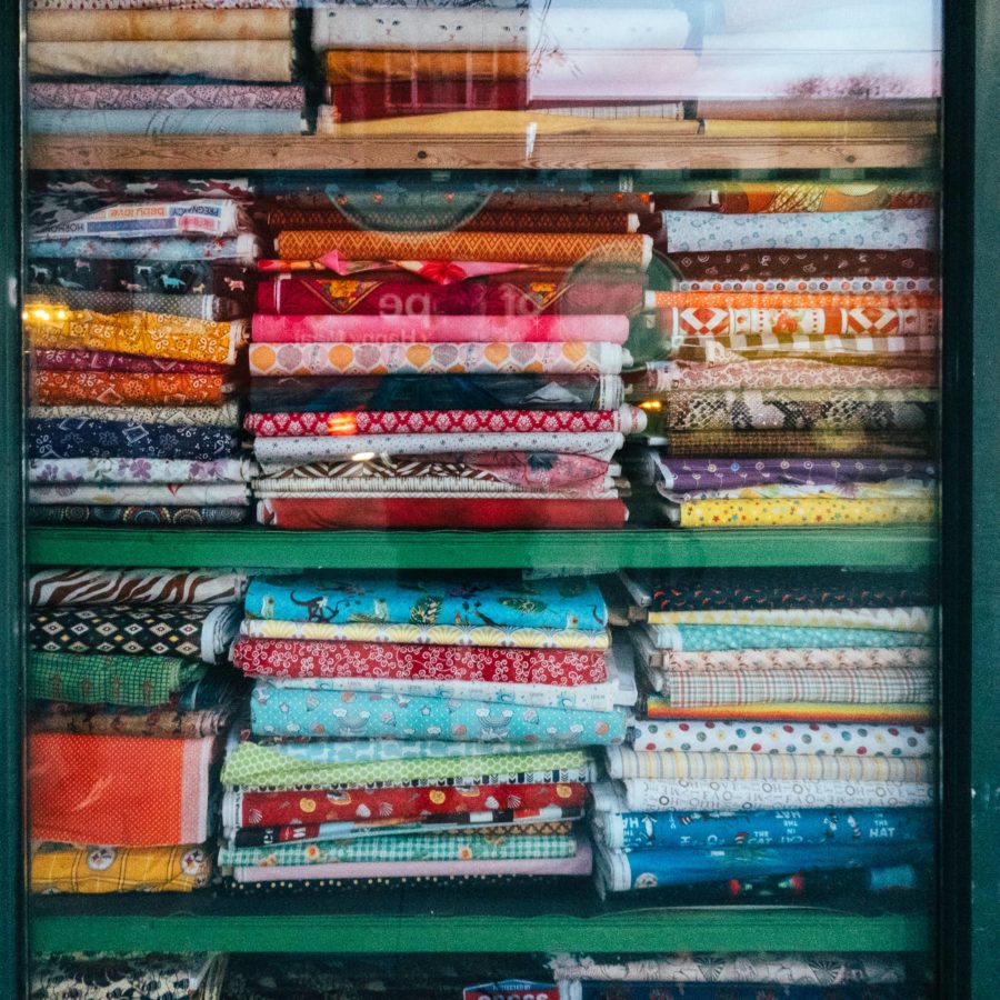 Bolts of fabric in a store window