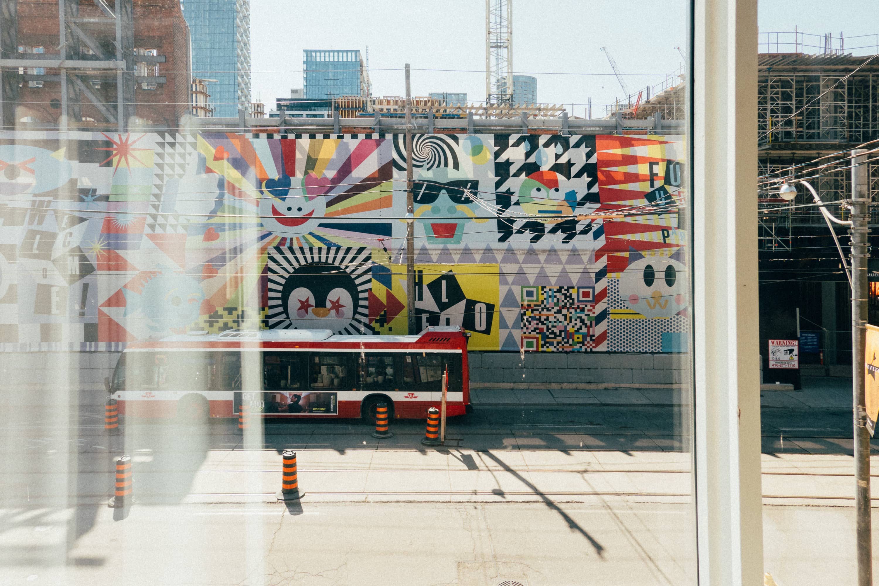 Emoji wrap by Douglas Coupland covering a redevelopment in Toronto