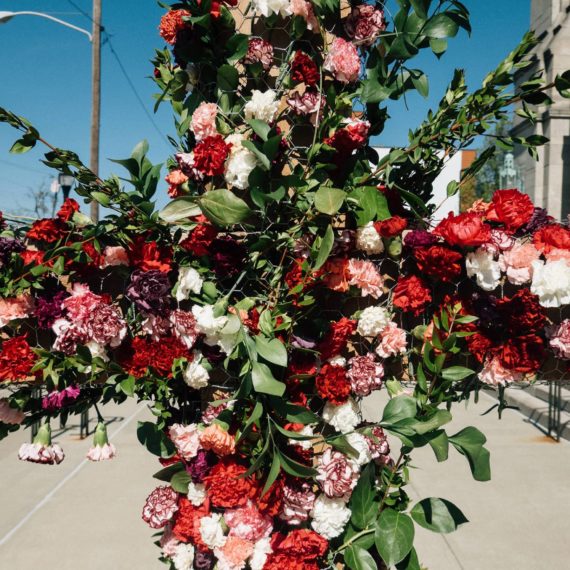 A cross decorated with flower