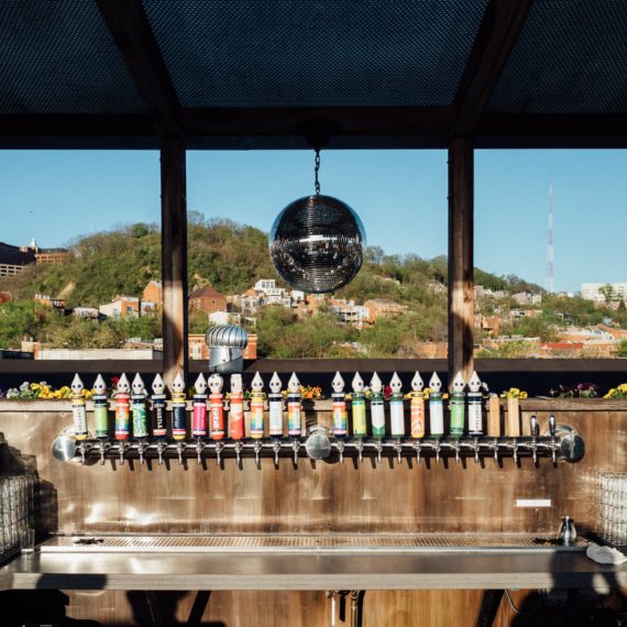 The taps of Rhinegeist on their rooftop patio with bonus disco ball