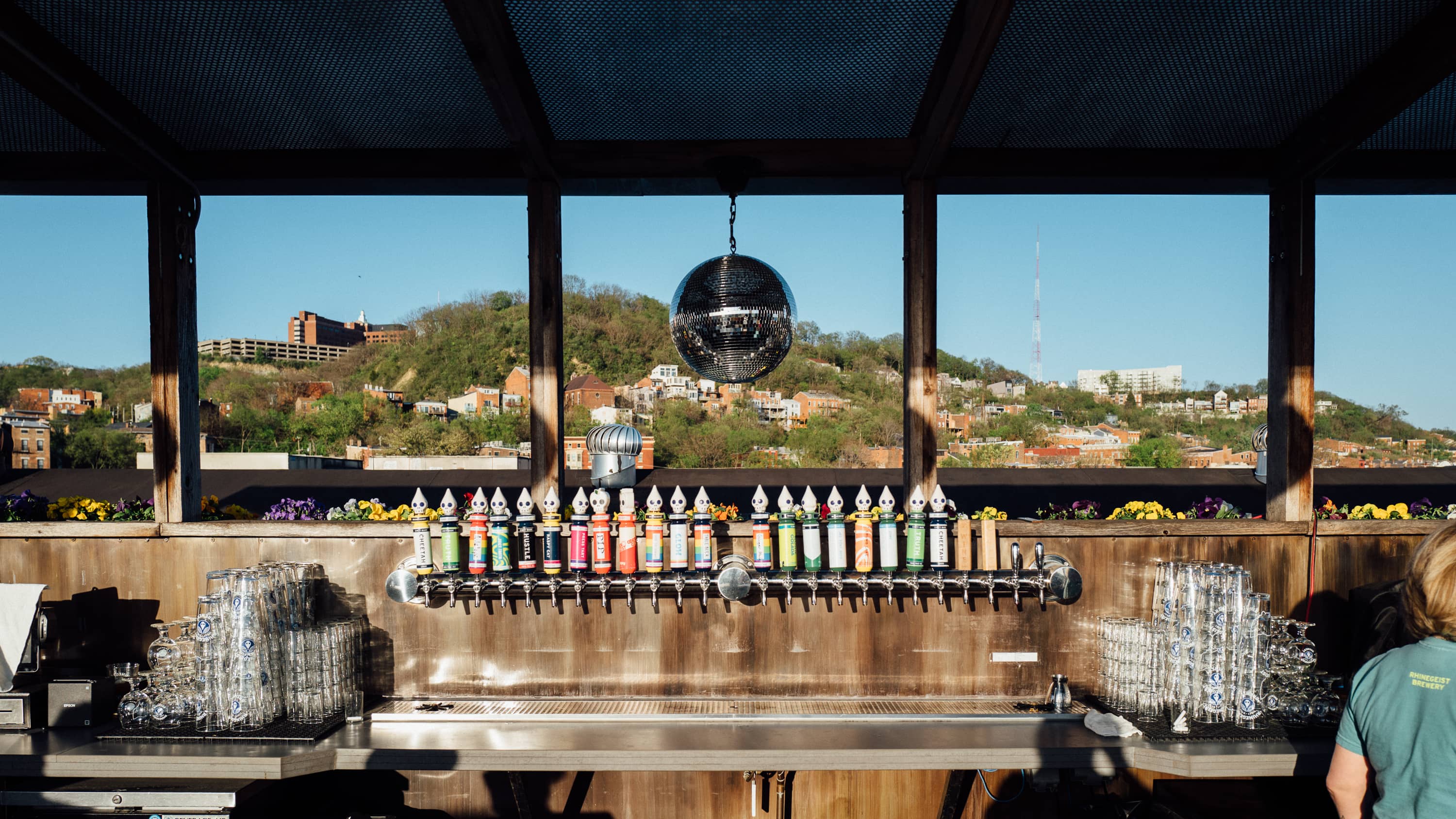 The taps of Rhinegeist on their rooftop patio with bonus disco ball