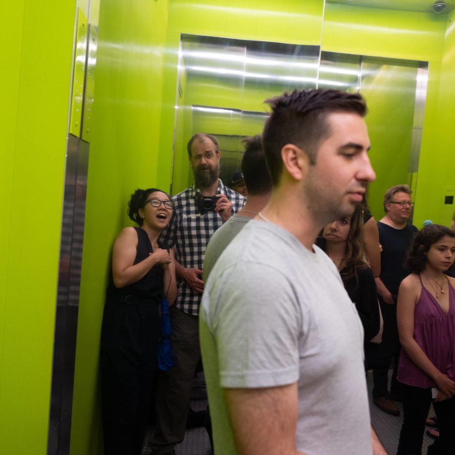 Green elevator with mirrored wall