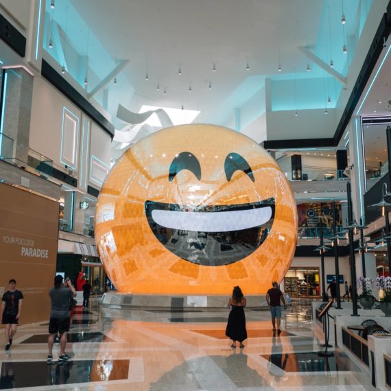 A large sphere with display and an emoji