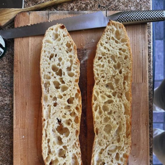 Sourdough bread sliced open on a cutting board