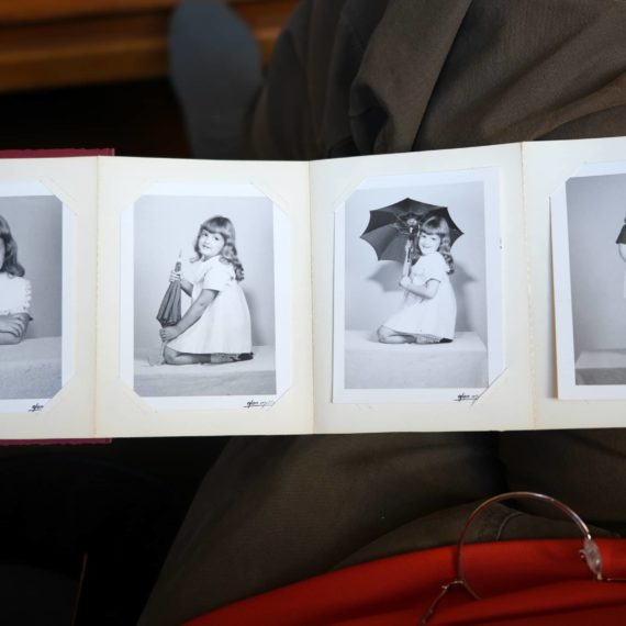 Four black and white photos of a young girl