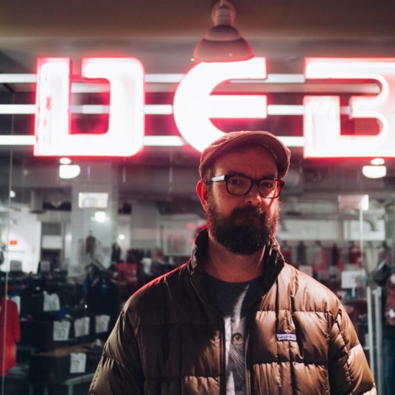 Man in front of DEB store