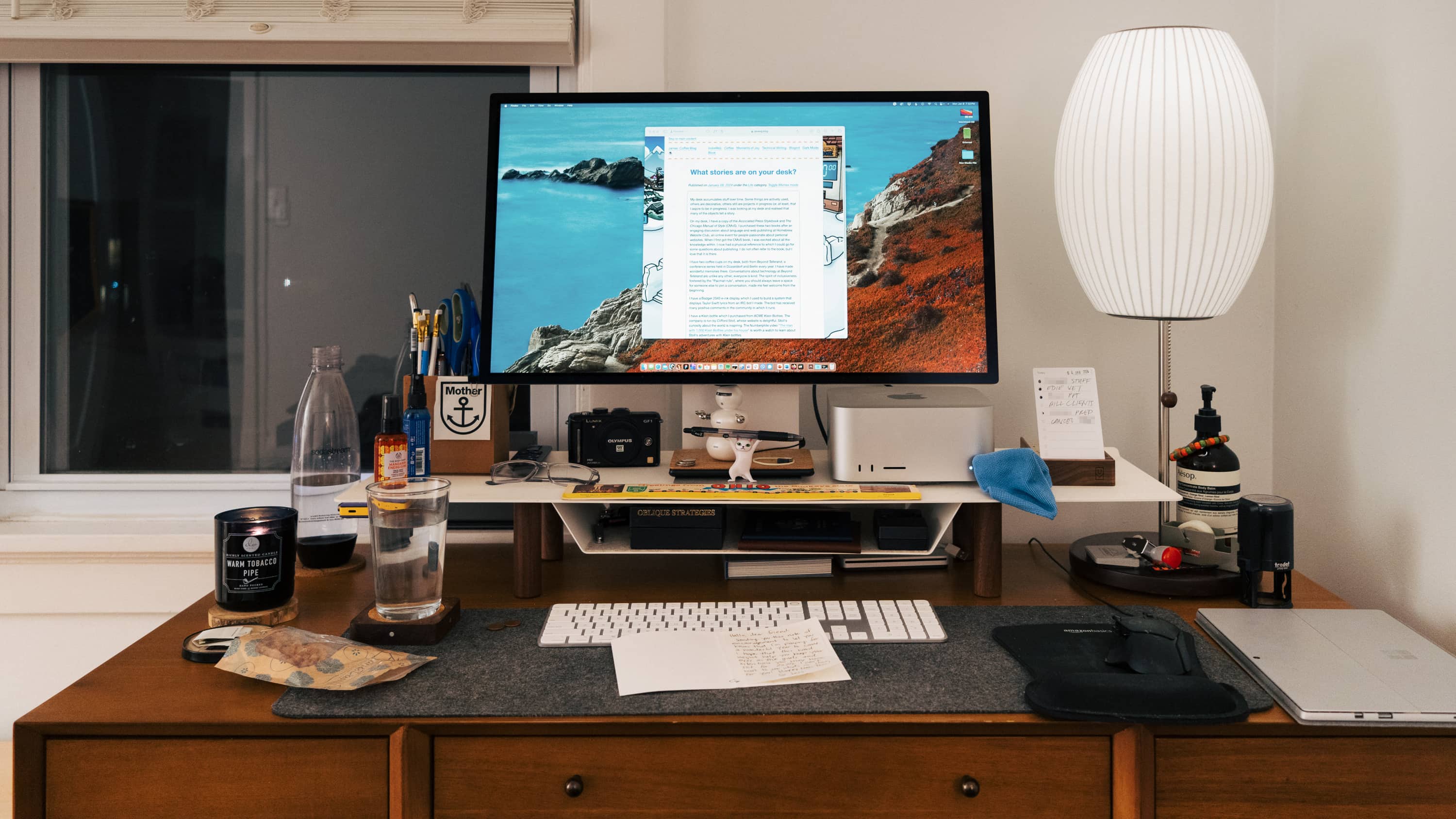 Desk with computer and a bunch of stuff