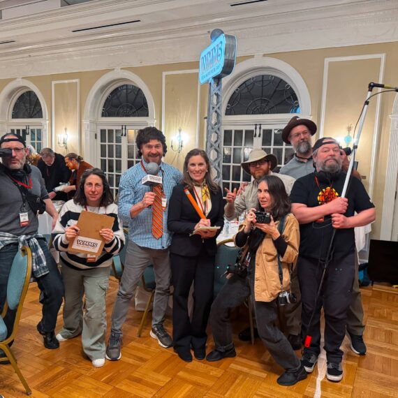 Trivia Night contestants dressed as news crew