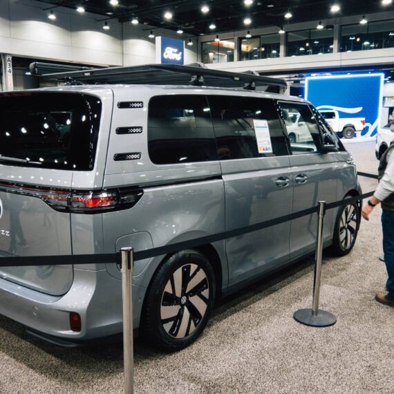 Man looks at roped off VW ID Buzz at an auto show